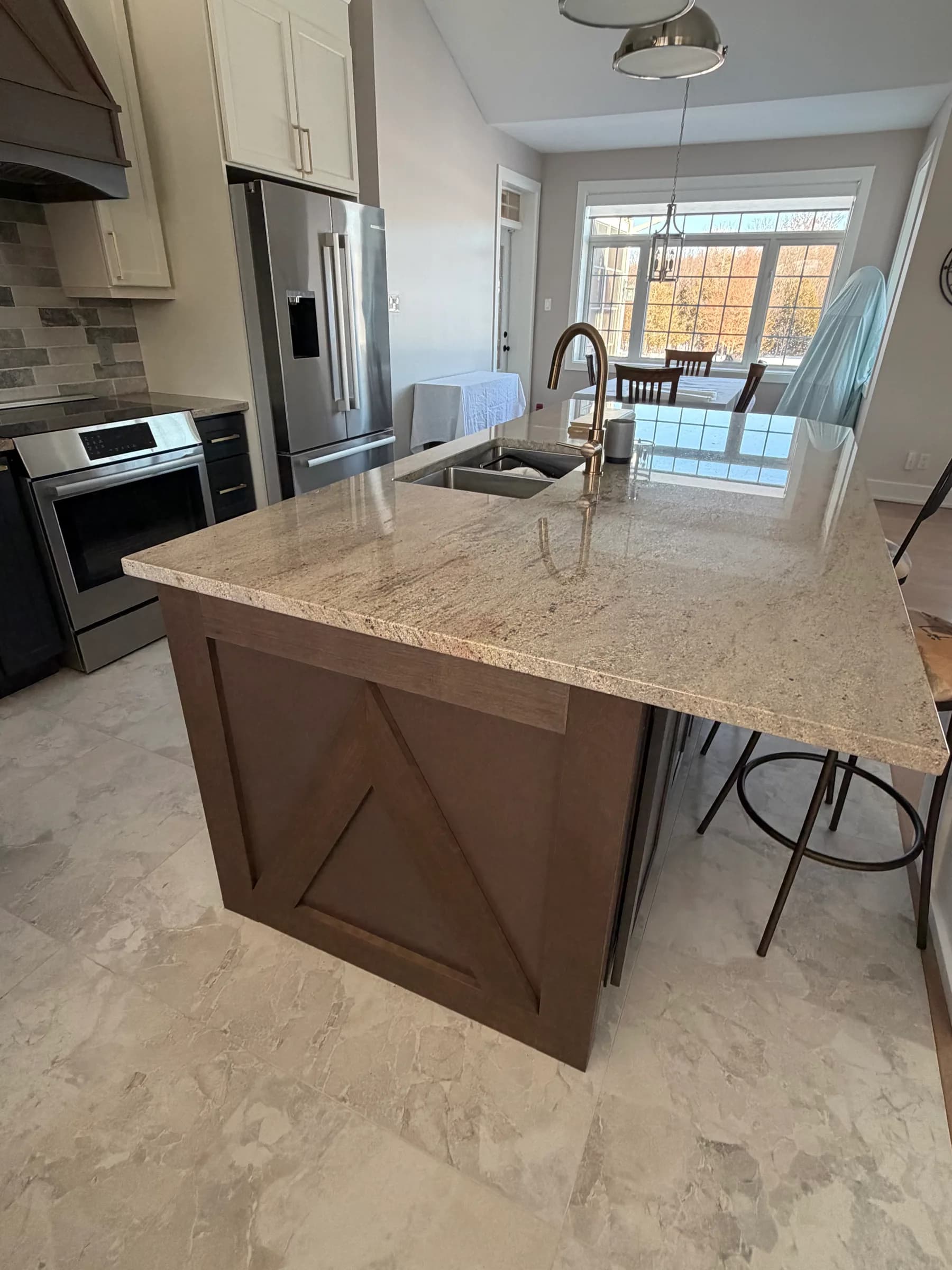Granite-topped kitchen island with X-brace end panel detail, Smiths Falls